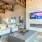 Apartments in Elk Grove, CA, for Rent - Vasari -Clubhouse with High Ceilings, Exposed Wood Beams, Fireplace, Seating Areas with Sofas, Armchairs, and Coffee Tables.