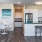Elk Grove, CA Apartments for Rent - Vasari - Dining Area with White Table and Chairs, Adjacent to Kitchen and Breakfast Bar with Bar-Style Stools.