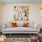 Apartments in Elk Grove, CA - Vasari - Living Room with Vinyl Plank Flooring, Grey Couch, Armchair, Glass-Top Coffee Table, Wall Art, and Large Window.